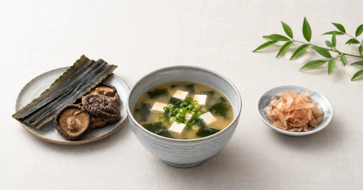 Miso soup between kombu and shiitake on the left and bonito flakes on the right